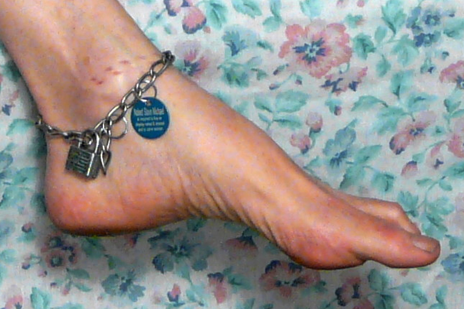 A gorgeous portrait of my beautiful left foot, with ankle chain and tag